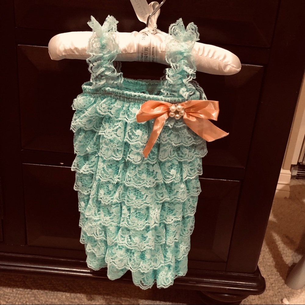 Infant lace romper from a boutique. Worn once